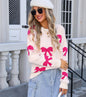 Warm Pullover with Jacquard Knit Bow Detail for Women with Draped Fit