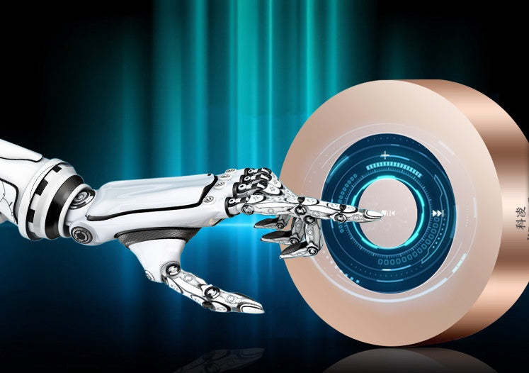 A futuristic white robotic hand touching the glowing blue interface of a round portable speaker.