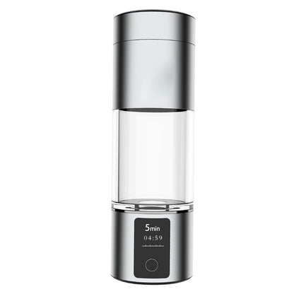 Silver hydrogen water bottle with a clear central chamber and digital display panel showing 5min timer.