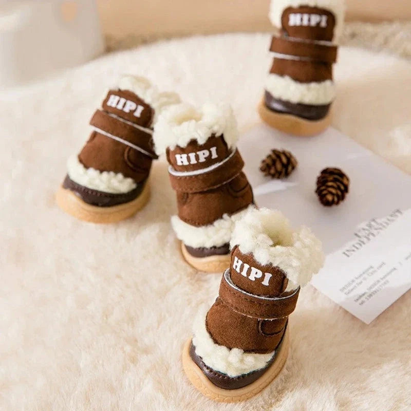 Four brown fleece-lined dog booties with velcro straps and text detail.