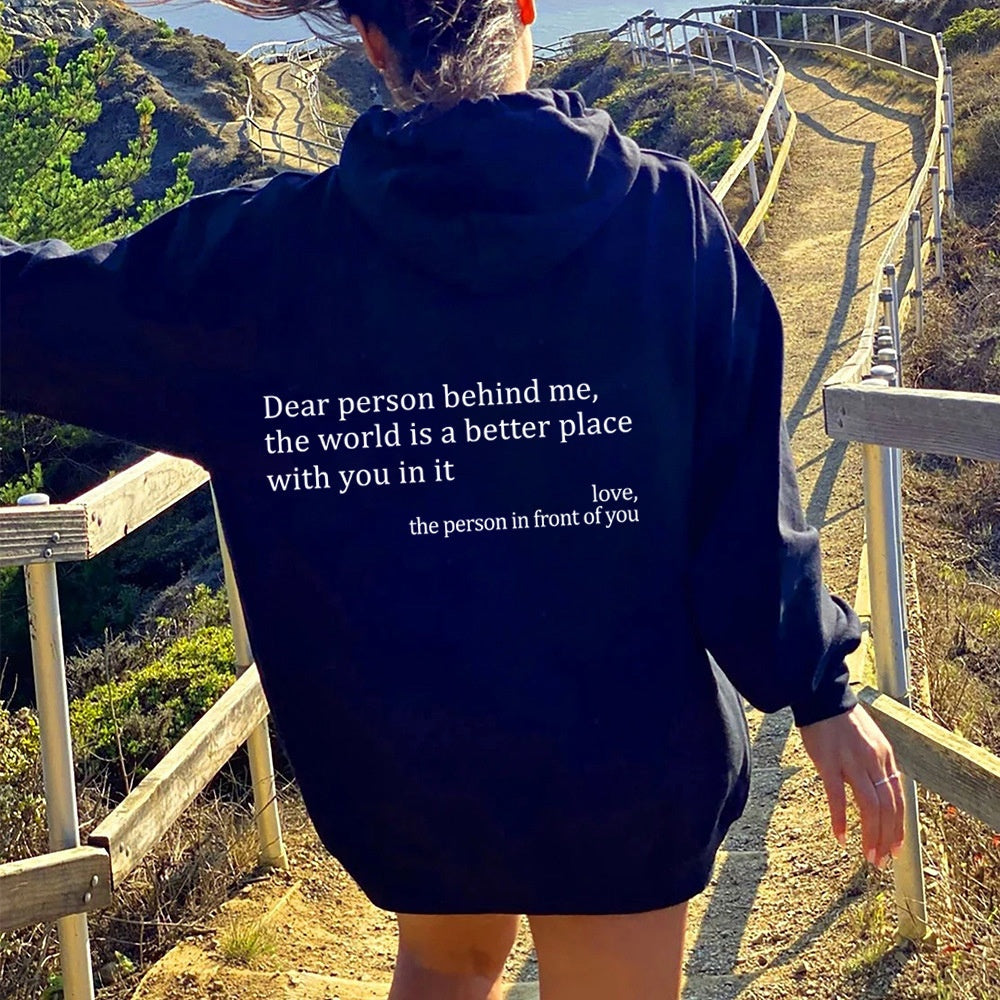 Black oversized hoodie with white letter print back design for casual daily wear.