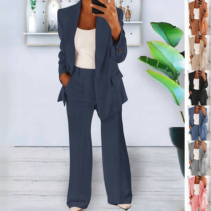 Women's dark blue slim-fit suit set with blazer and pants worn with a white top