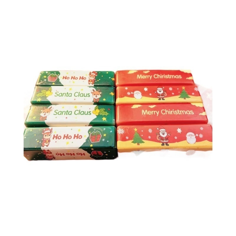 Eight butter-stick squishy toys in Christmas designs arranged in two rows