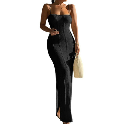 Black, fitted, knit suspender dress with a side slit for modern everyday wear.