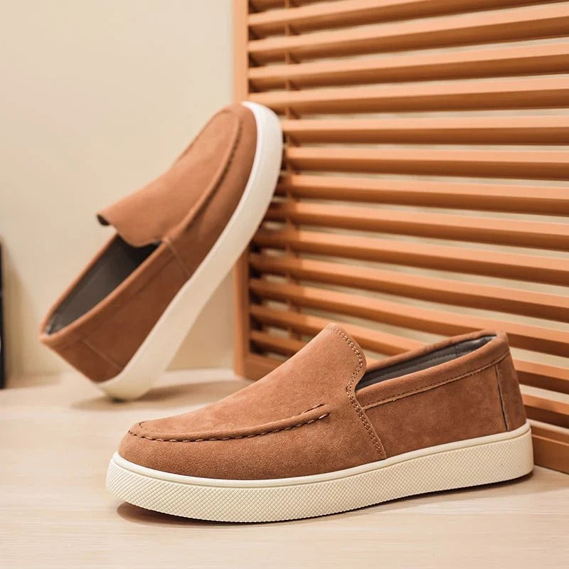 Suede loafers front view showing slip-on cut