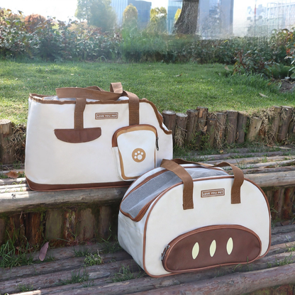 Collapsible pet travel carrier bag in white and brown with carrying handles and front pocket outdoors