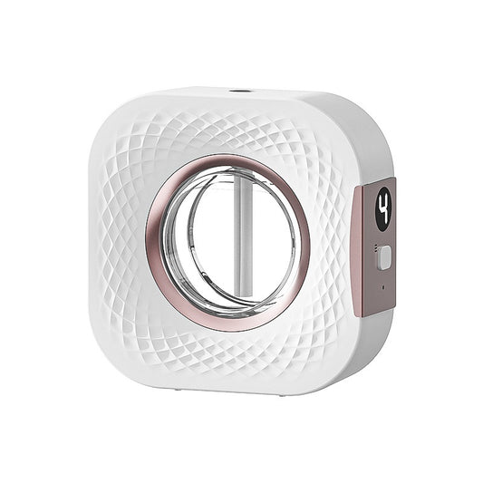 White cordless aroma diffuser with textured front, rose gold circular accent, and side digital display and button