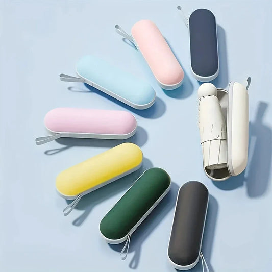 Eight compact folding umbrellas in colorful capsule cases arranged in a circle.