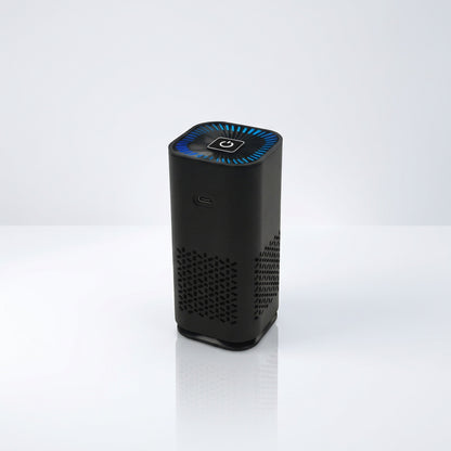 Tall black portable air purifier with a blue lit top control panel and perforated ventilation sides.