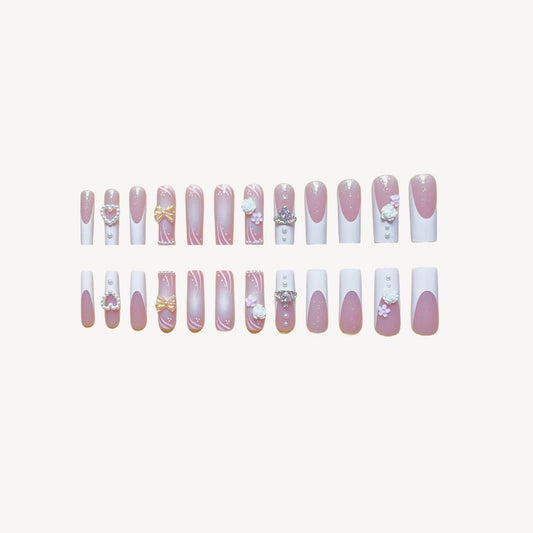 Press on nails rectangular with mirror shine, pearl charms, bows, and faux gems