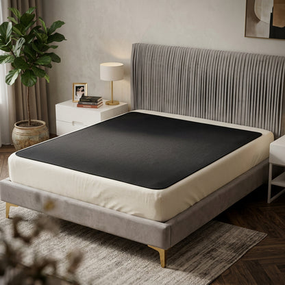 Grounding earthing bed mat laid across a mattress in a styled bedroom