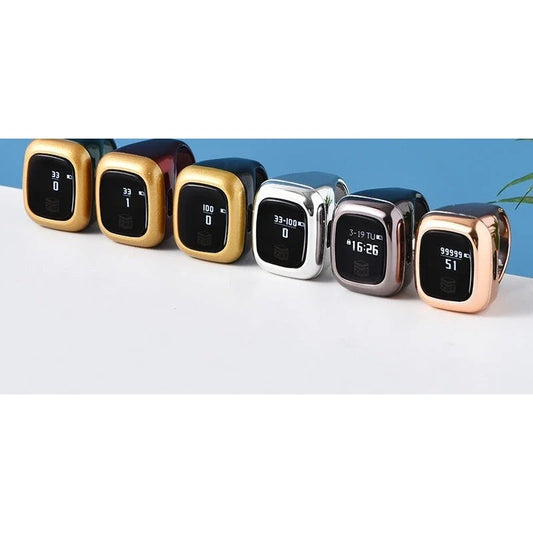 Six digital tasbih counter rings in various metallic finishes with small screens arranged in a row.