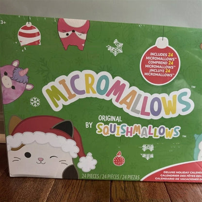 Green advent calendar box featuring cute plush characters and holiday graphics.