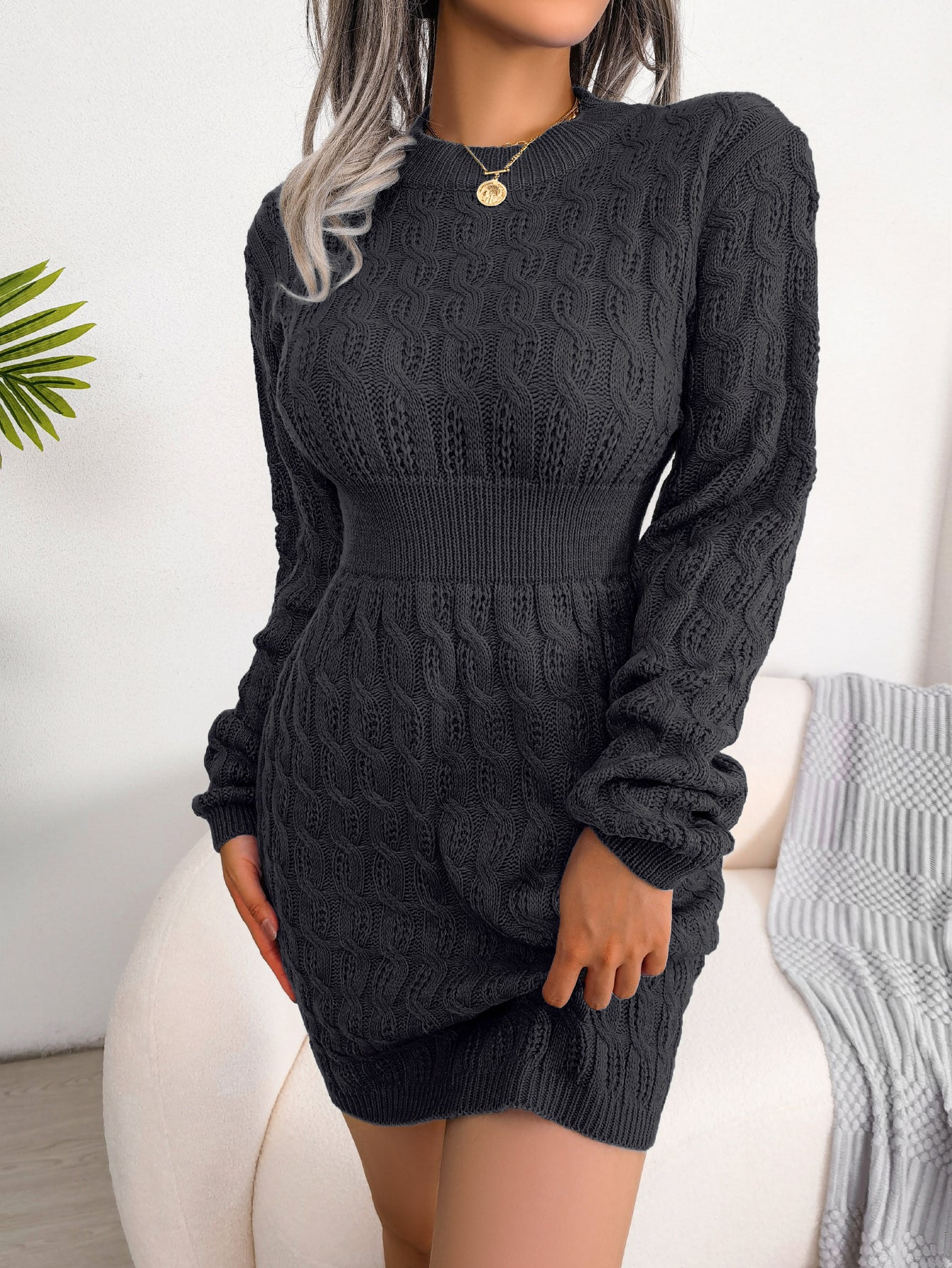Charcoal gray cable knit sweater dress with a sculpting waistband for a fitted look during fall and winter outings.