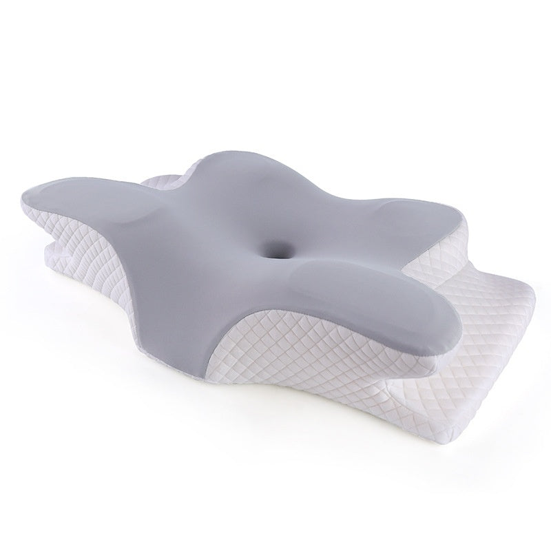 Contoured memory foam neck pillow in butterfly shape, angled view