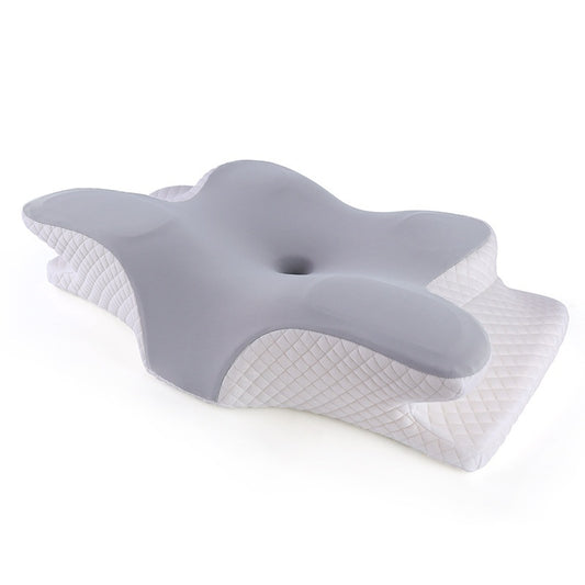 Contoured memory foam neck pillow in butterfly shape, angled view