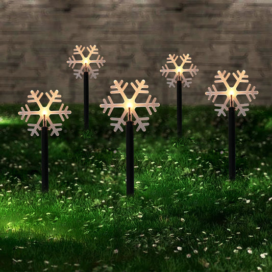 Solar snowflake outdoor Christmas garden lights staked in grass