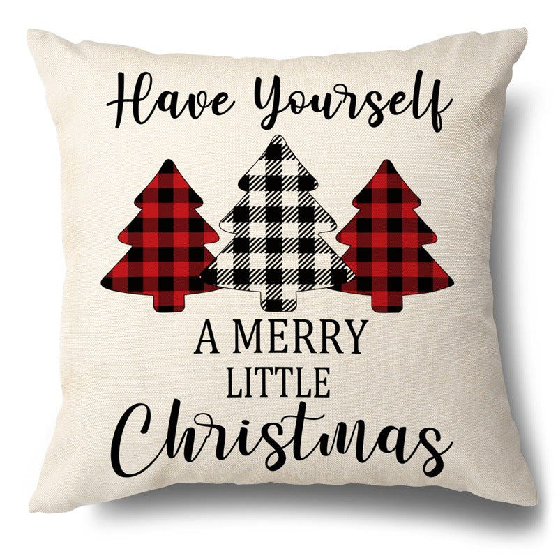 Beige pillow cover with buffalo plaid Christmas trees and Have Yourself A Merry Little Christmas text.