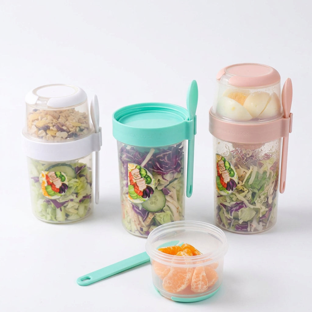 Three salad cups with salads and a detached sauce cup with orange slices