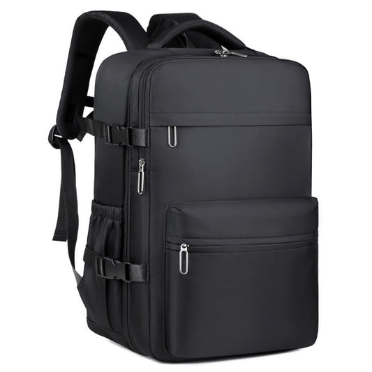 Travel backpack with integrated vacuum compression and front zipper pocket