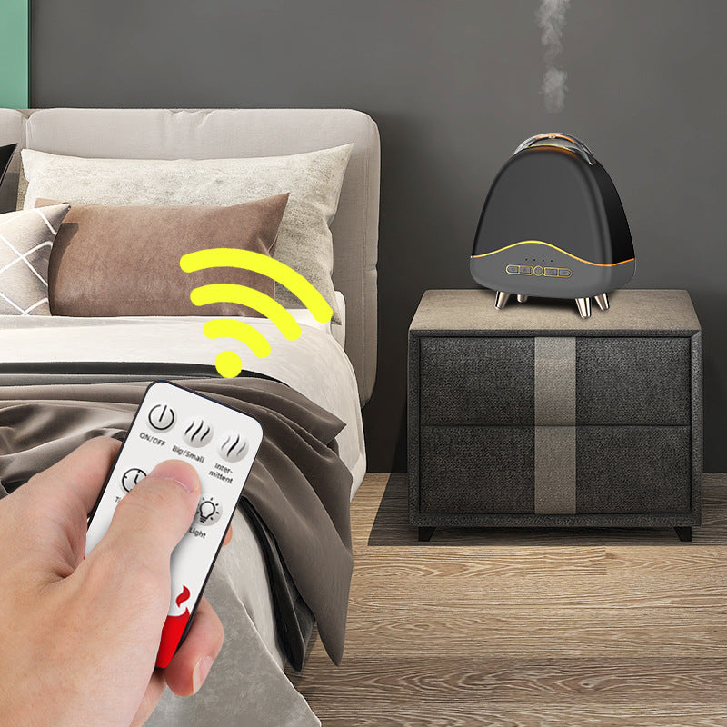 Aroma diffuser releasing mist on a nightstand, operated by remote control