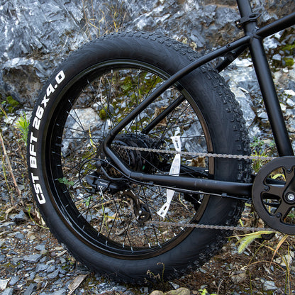 Matte black aluminum frame all-terrain bike with thick 26-inch tires for rugged trail riding.