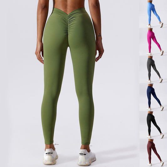 Rear view of a person wearing high-waist olive green sculpt leggings with ruched detailing.