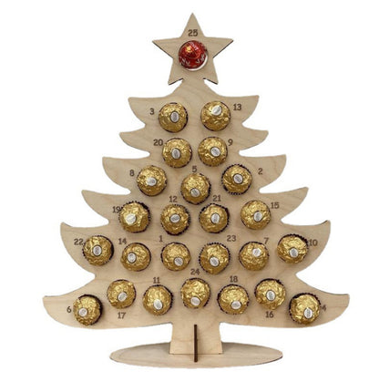Wooden Christmas tree advent calendar holding foil-wrapped round candies.
