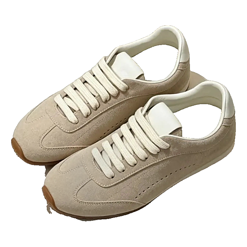 Unisex beige suede-look retro runner sneakers with white laces and gum soles on a light surface