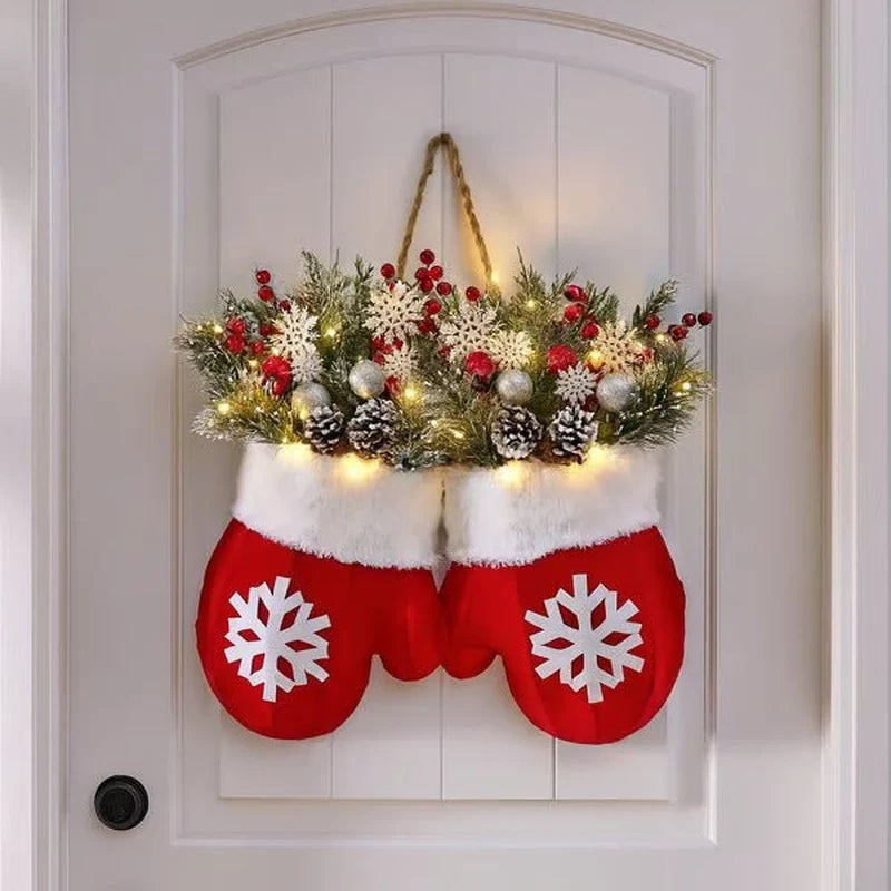 Lighted Christmas mitten wreath with pinecones on a door
