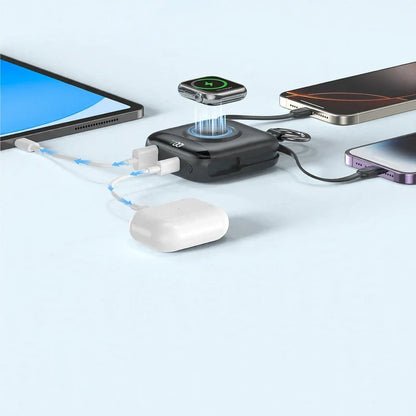 Compact black power bank charging multiple devices like phones, earbuds, and a smartwatch simultaneously.