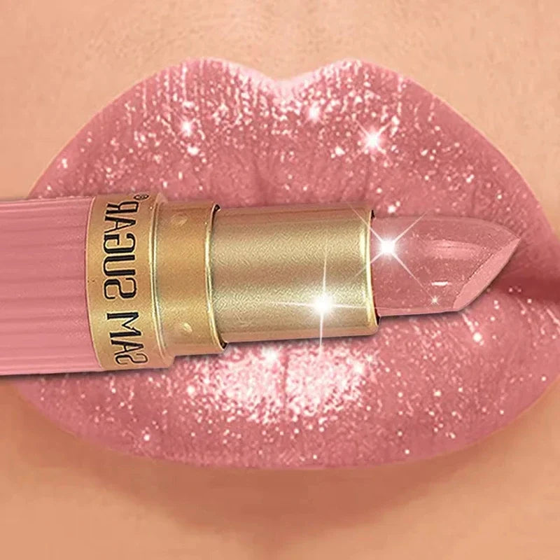 Pink lipstick with a gold tube applied to shimmering lips