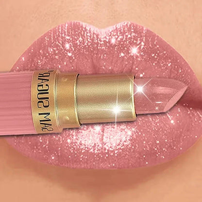 Pink lipstick with a gold tube applied to shimmering lips