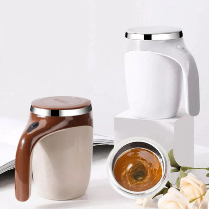 White and brown self-stirring magnetic mugs with liquid swirling inside.