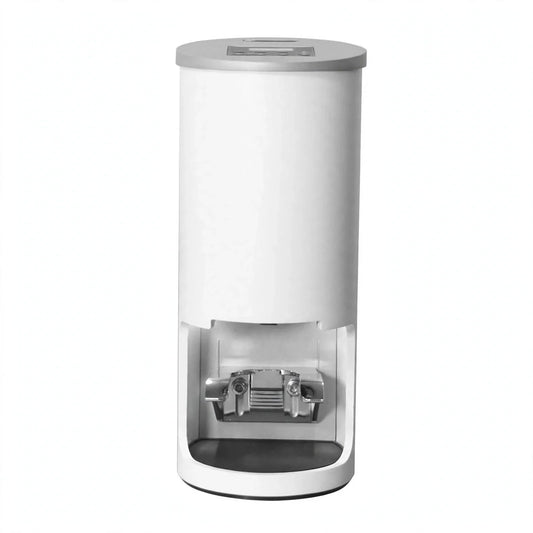White automatic electric espresso tamper with digital display top and metallic portafilter slot.