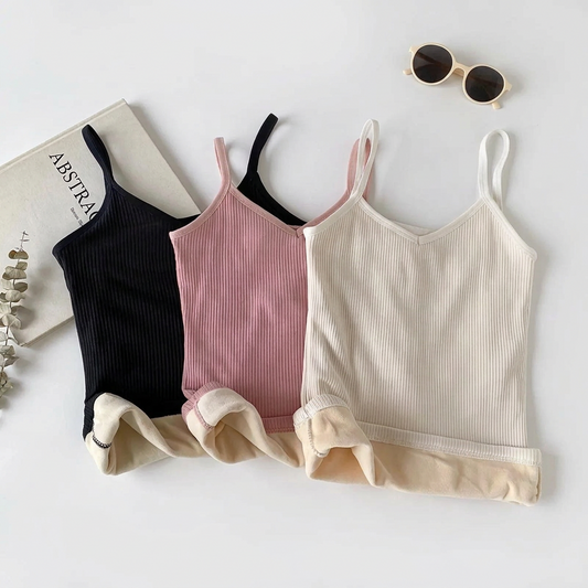 Three ribbed thermal camisoles in black, pink, and white with plush lining.
