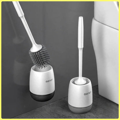 White silicone toilet brush with flexible bristles held inside a matching white and dark grey holder.
