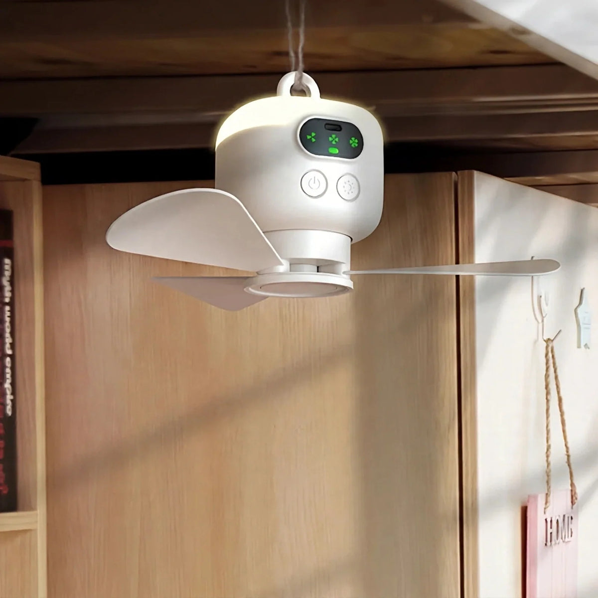 White hanging ceiling fan lamp with digital display and control buttons, suspended indoors.