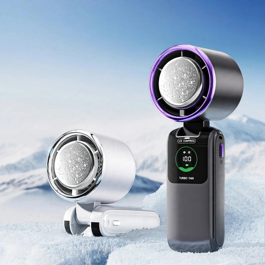 Two handheld turbo cooling fans with ice compress plates and digital speed displays in a snowy setting.