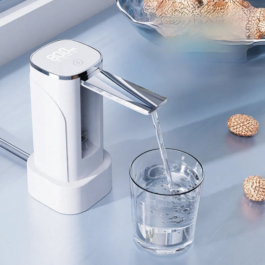White electric water dispenser pump dispensing water into a glass