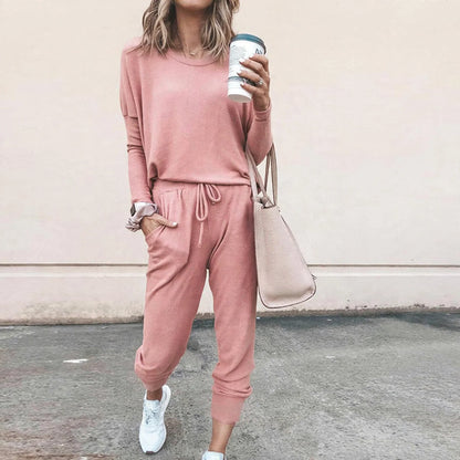 Two-piece lounge set featuring a long sleeve top and drawstring joggers with pockets