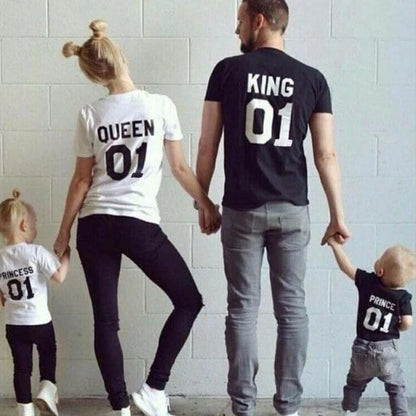 Family of four wearing matching t-shirts printed with King, Queen, Prince, and Princess 01 designs.