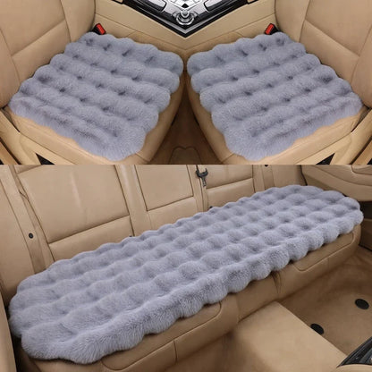 Gray fluffy tufted car seat cushions installed on tan leather seats in split top and bottom views.