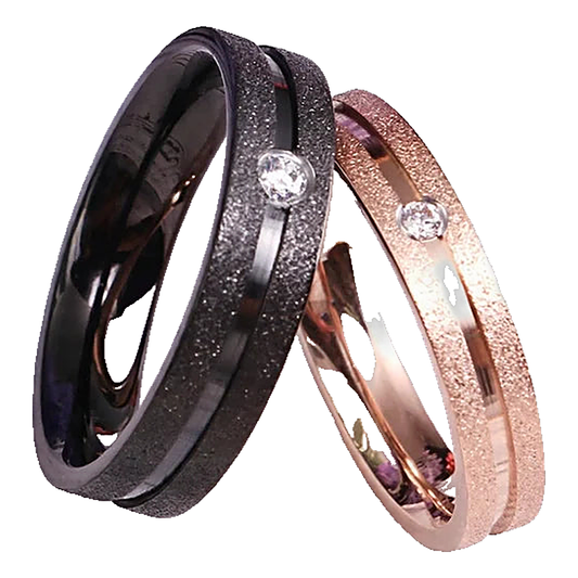 Pair of slim textured band rings each set with a single small stone