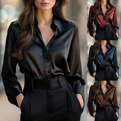 Woman wearing a long-sleeve black button-down shirt with black pants.