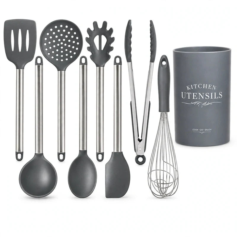 Grey silicone kitchen utensil set with metal handles and holder