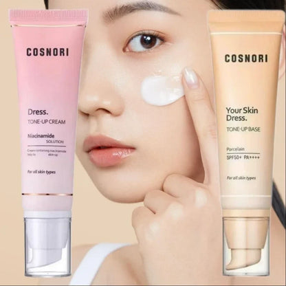 A pink and a beige tone-up cream tube flanking a model applying white cream to her cheek.