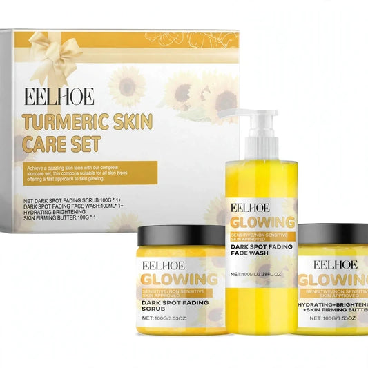 Turmeric skincare kit with a pump bottle, two jars, and a decorated gift box.