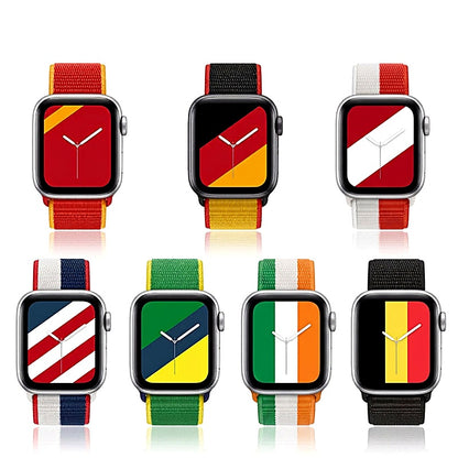 Seven smartwatches with nylon bands featuring different country flag designs.