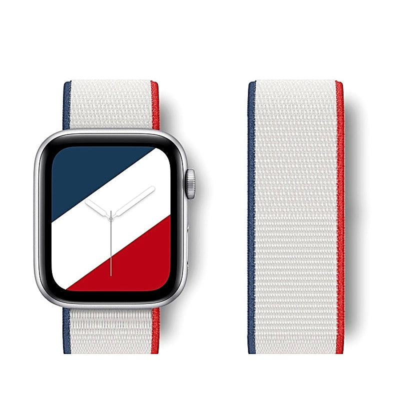 White nylon watch band with blue and red side stripes attached to a smartwatch with a matching watch face